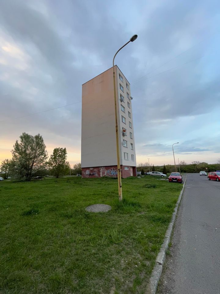 The meme is a photo of a tall, abandoned apartment building with a streetlight in front of it. The image is captioned "I'm not arguing, I'm just explaining why I'm right." The building's appearance is meant to be humorous, implying that someone is so confident in their own rightness that they are willing to stand alone, like the building, in their own opinion.